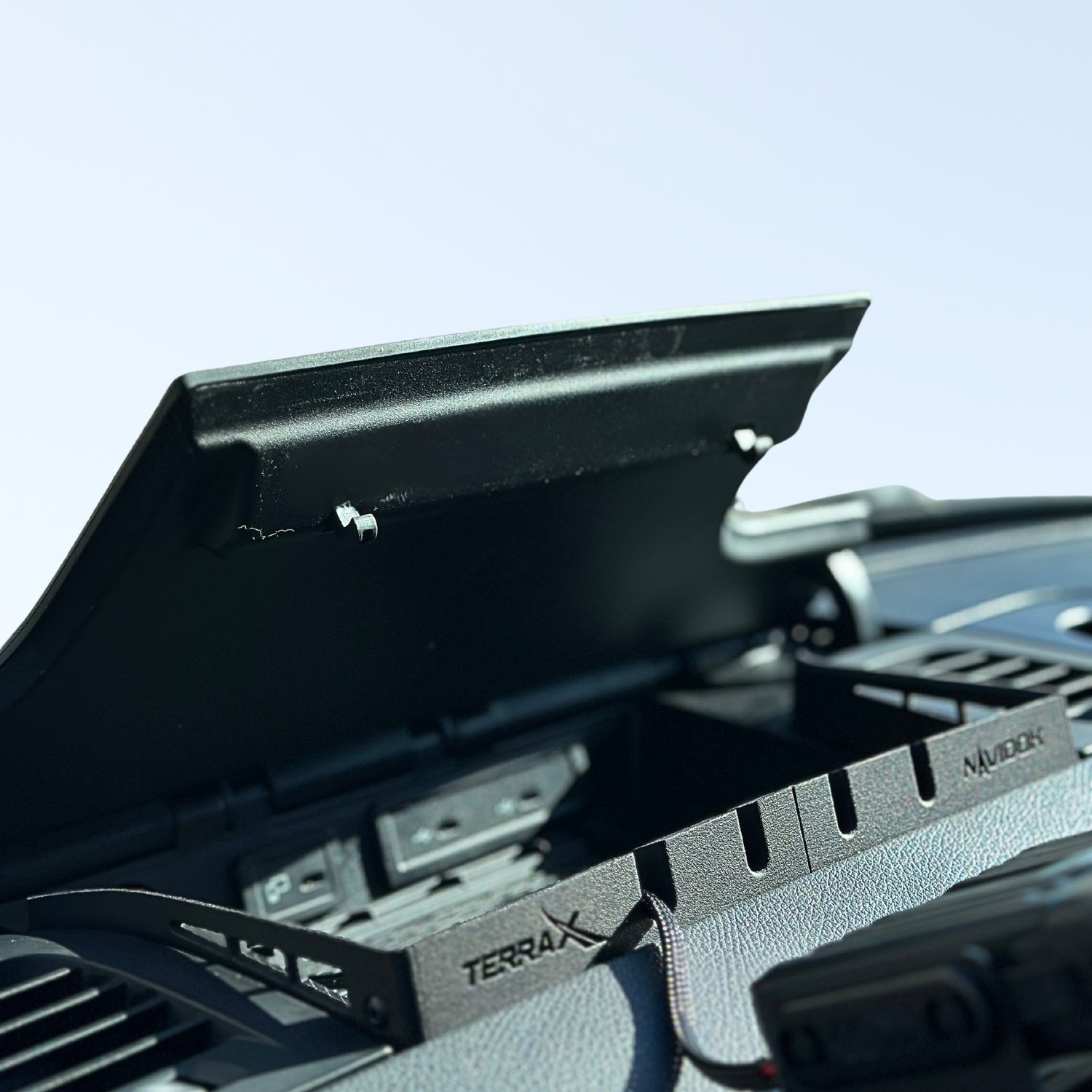Charge Groove 3D-printed accessory for Mercedes van, showing open dash compartment with accessible charging ports and improved cable management