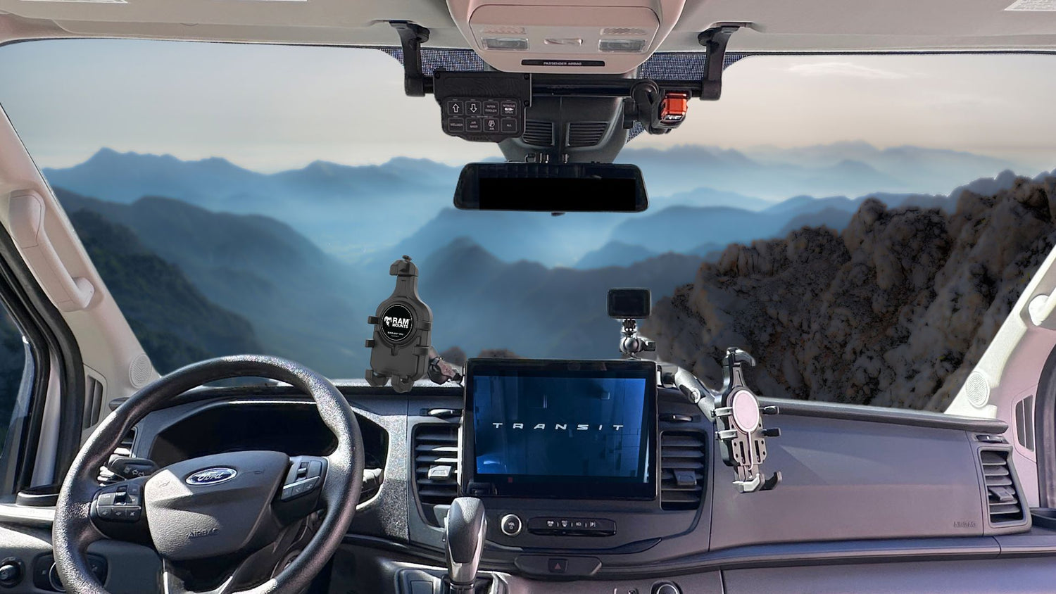 Car interior with dashboard view, steering wheel, and windshield showing our terra x dash and visor mounts.