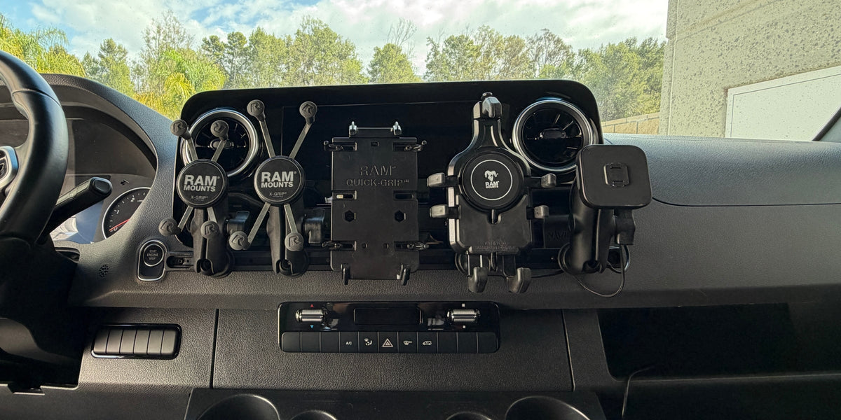 Five phone holders mounted on a Mercedes Sprinter dash: RAM X-Grip Universal, X-Grip Large, Quick-Grip XL, Quick-Grip Pro, and Peak Design locking charging mount
