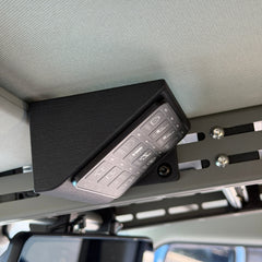 Cabdok Switch-Pros Mount holding a Switch-Pros 12 switch panel at an angle on the driver's side of the Cabdok