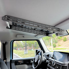 Cabdok overhead storage mount in Ineos Grenadier viewed from passenger side, clear of windshield and dash controls